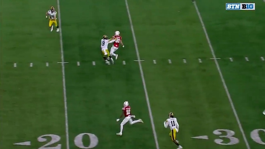 tv screen shot of iowa vs nebraska game, two wide receivers try to get open
