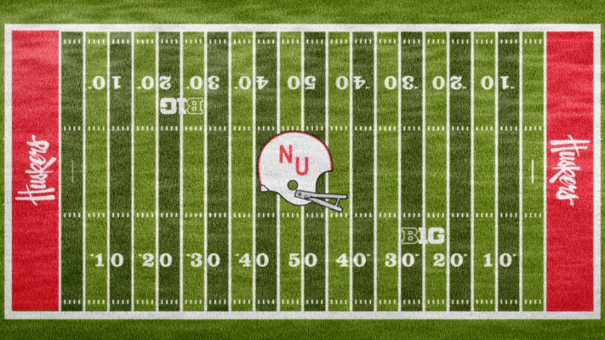 aerial view of nebraska field for game day with vintage helmet in the middle