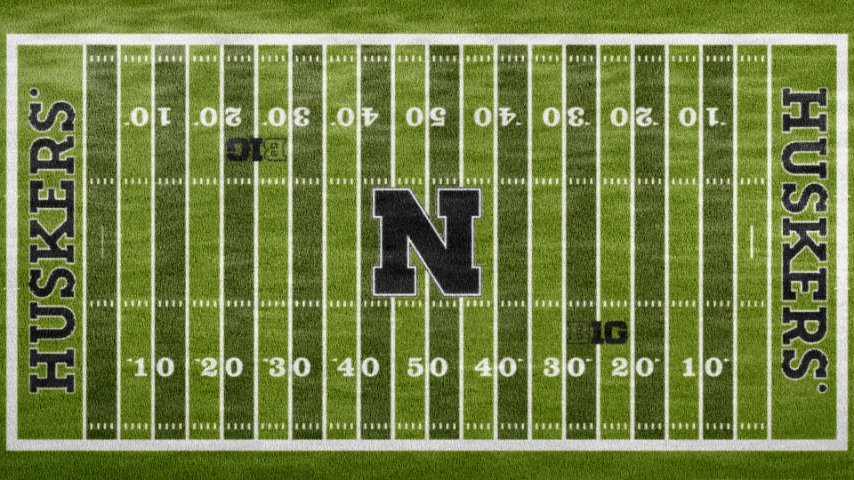 aerial view of field with big nebraska N in black and huskers outlined in black in each endzone